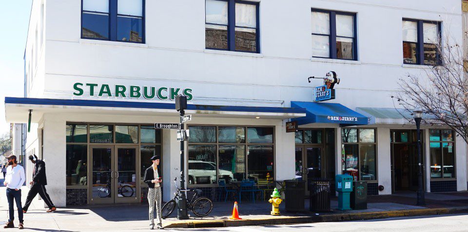 Starbucks storefront on a city street.