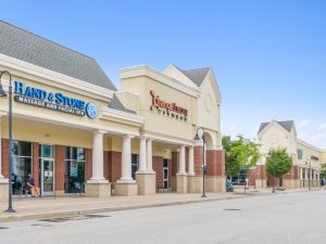 Exterior view of a strip mall with several businesses.