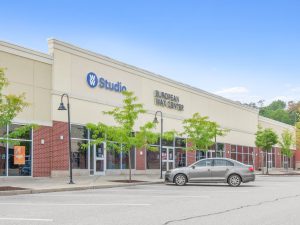 Exterior view of a commercial building with "Studio" and "Burnley Day Center" signage.