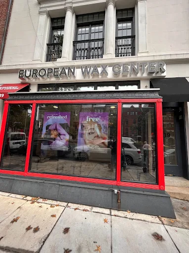 Woman standing outside European Wax Center