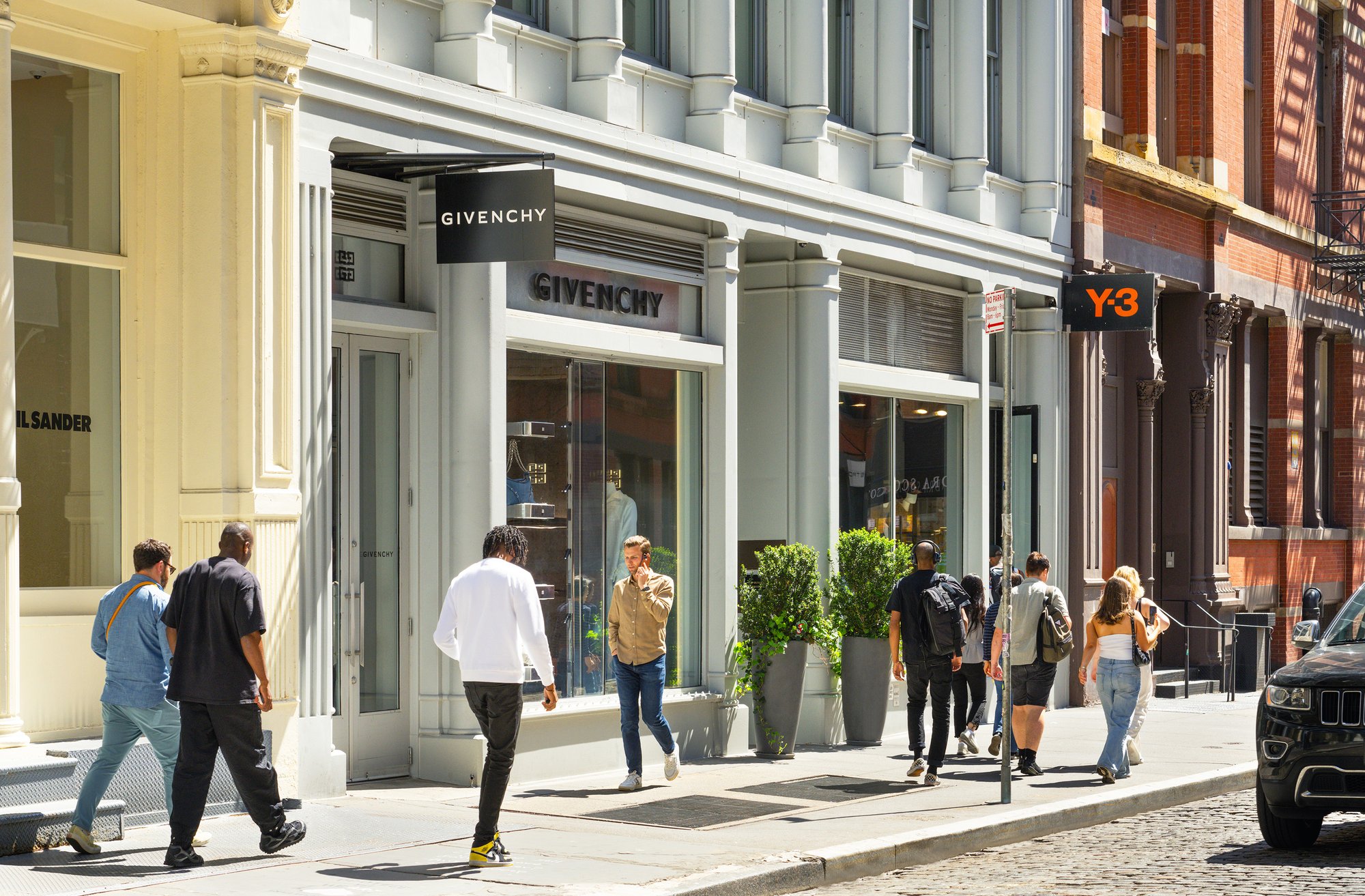 Givenchy store front with pedestrians.