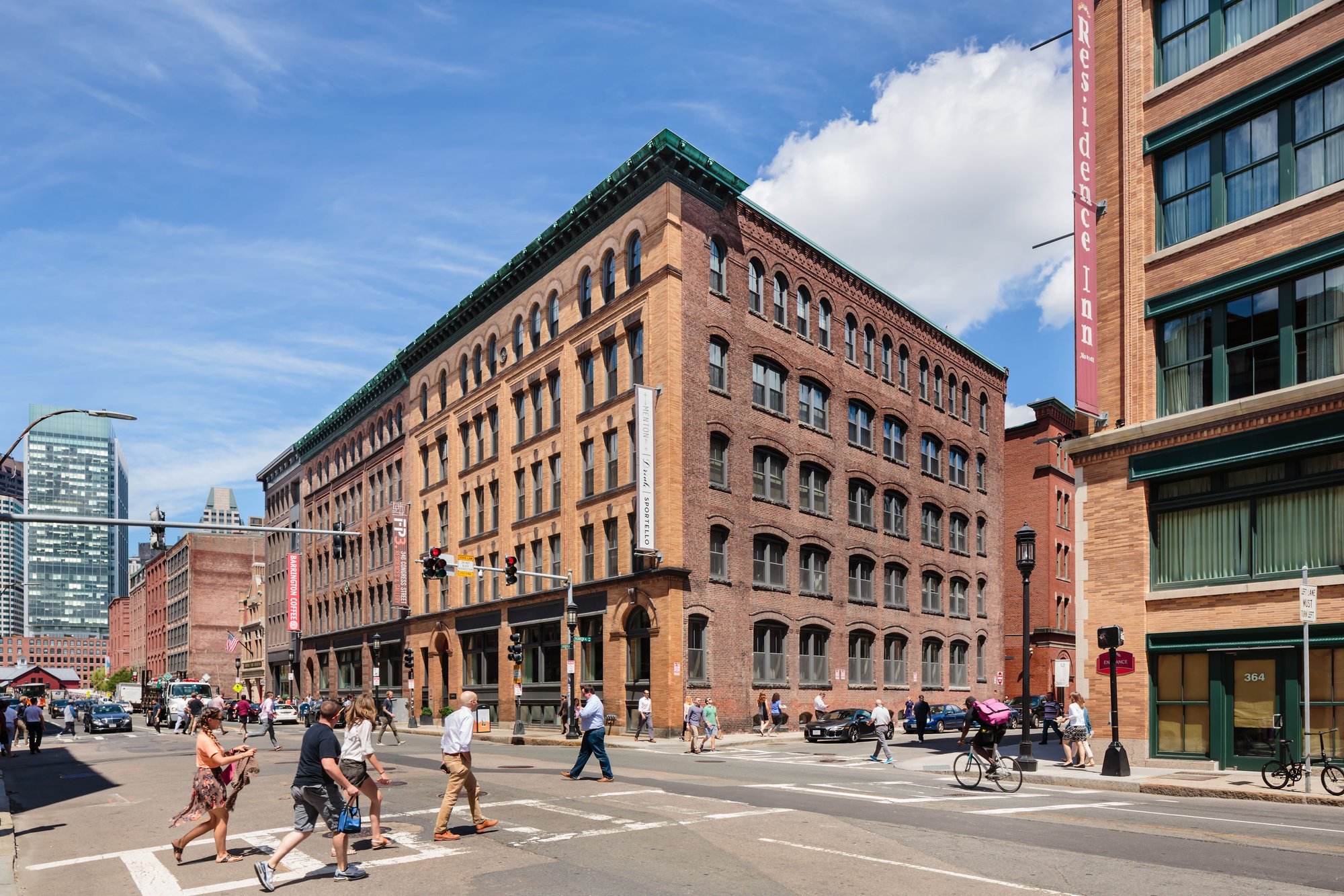 Large brick building on a city street.