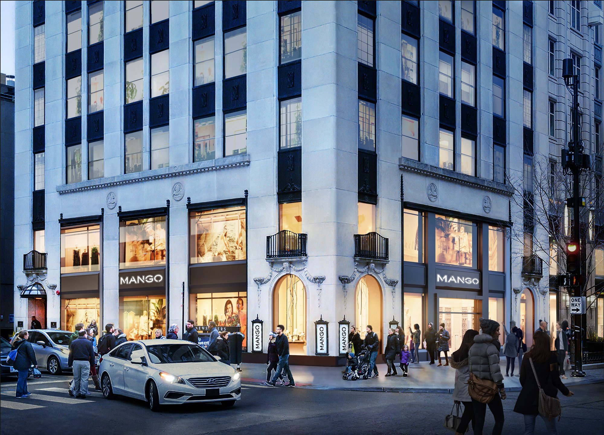 Modern building with retail spaces at street level at night.