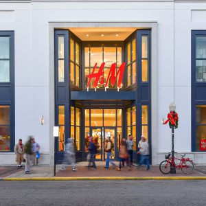 H&M store entrance with shoppers.