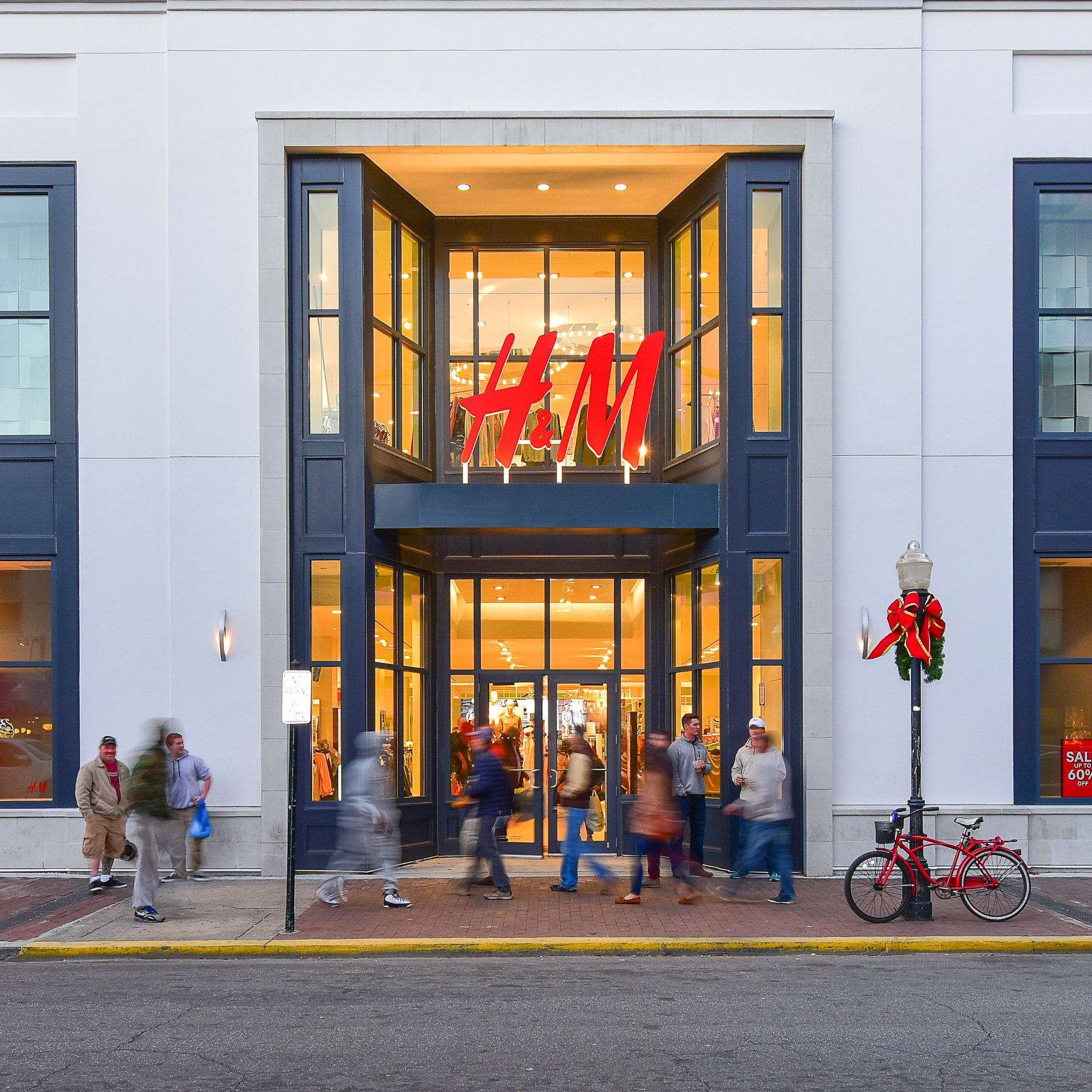 H&M store entrance with shoppers.