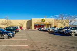 A Buff City Soap store with cars parked in the lot.