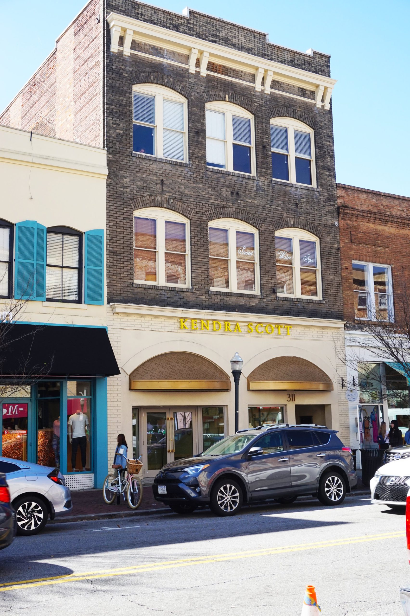 The Shenandoah Society storefront in a brick building.