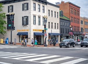 Street corner with pedestrians and shops in Washington, D.C.