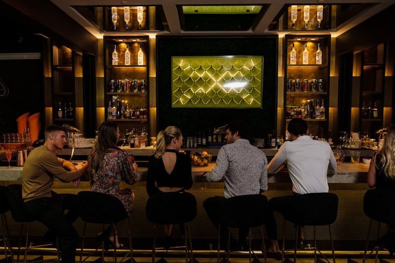Group of friends sitting at a bar