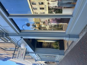Exterior view of Magazzino clothing boutique storefront.