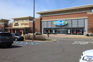 Old Navy store in a shopping center parking lot.