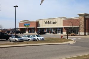 Kirkland's and other stores in a strip mall.