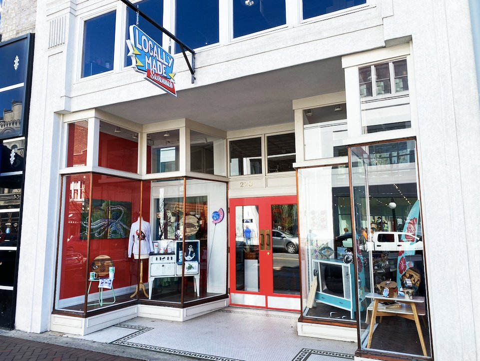 Locally Made storefront with red and white exterior and display windows.