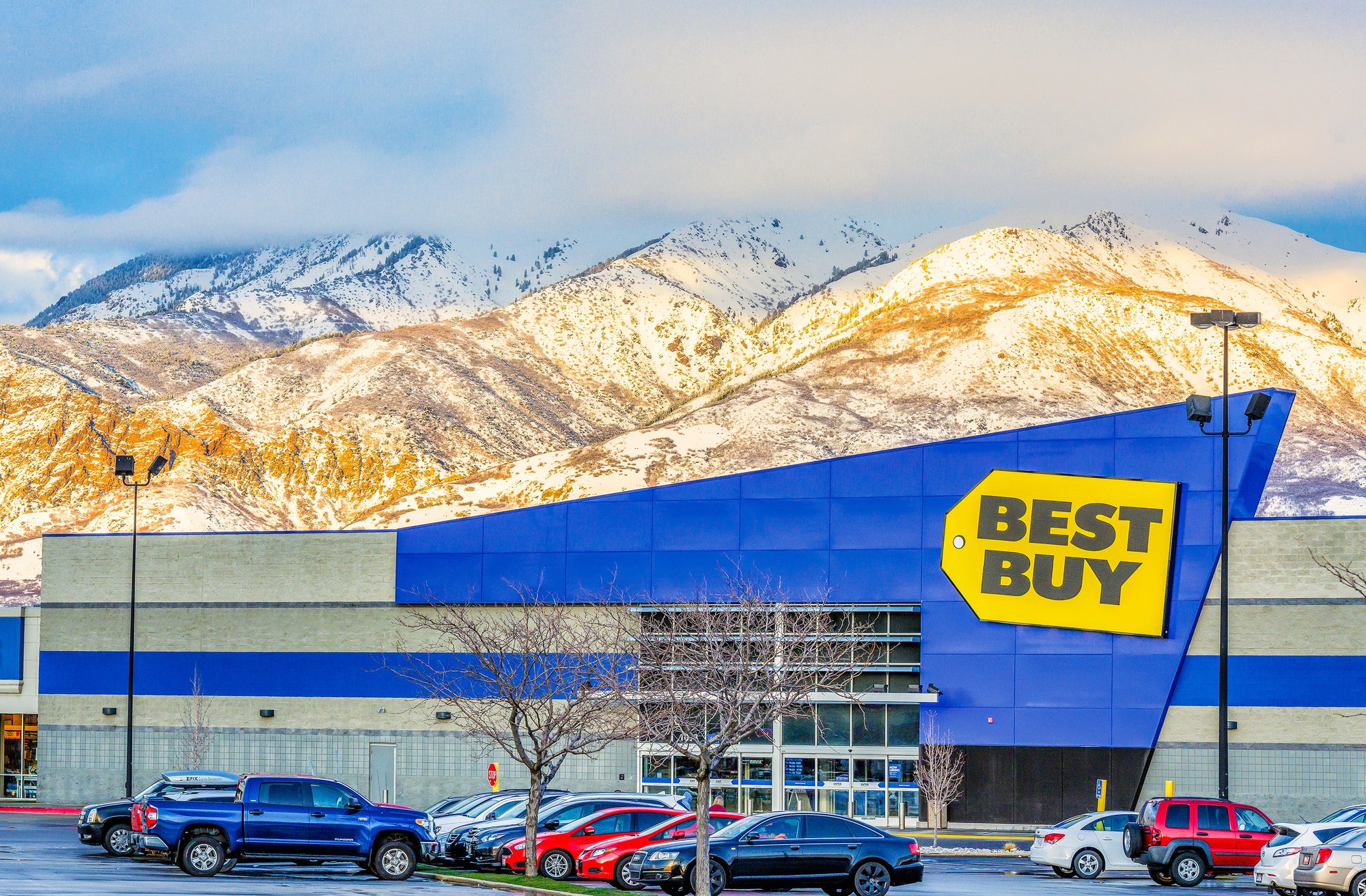 Best Buy store with snow-capped mountains in the background