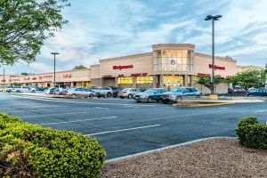 Walgreens store with parking lot at dusk.
