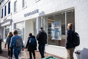 People walking past a Free People store.