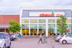 Shaw's supermarket exterior with shoppers.