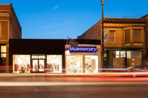 Blue Mercury storefront at night.