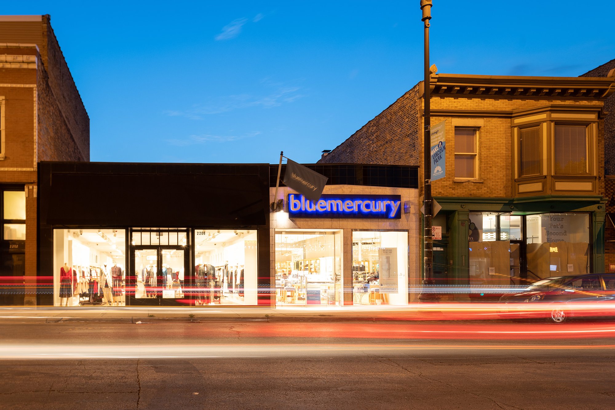 Blue Mercury storefront at night.