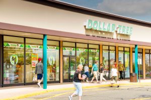 Dollar Tree store exterior with customers entering and exiting.