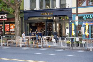 The Nizza restaurant storefront with outdoor seating.