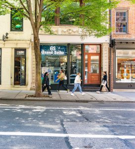 Grand Junction shop on a city street with pedestrians.