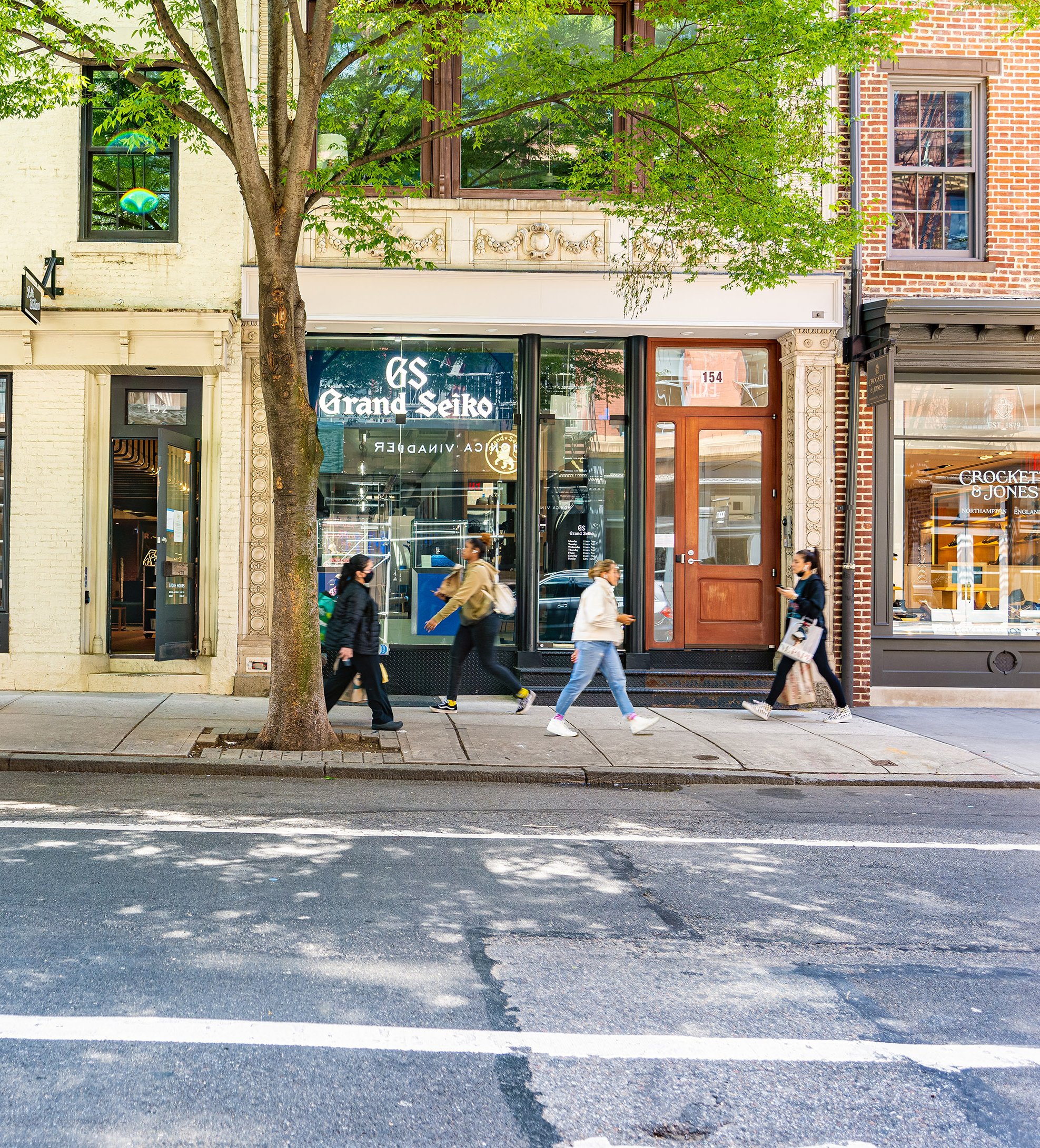 Grand Junction shop on a city street with pedestrians.