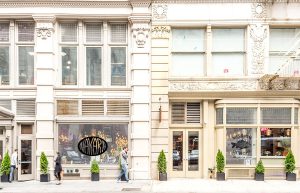 Exterior view of two adjacent shops in a city.