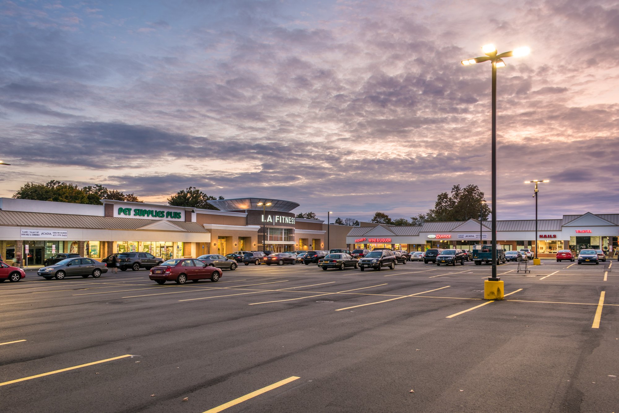Shopping center at dusk.