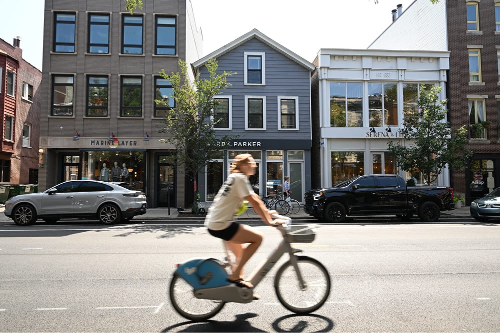 Person riding a bike on a city street.