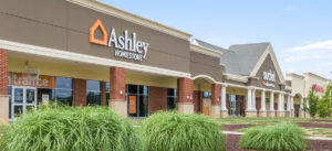 Exterior view of a strip mall with several businesses.