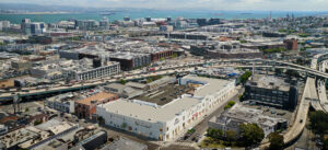 Aerial view of a city harbor and industrial area.