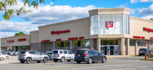 Walgreens store with parking lot at dusk.