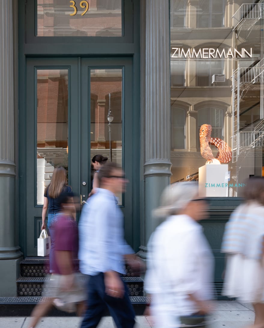 Zimmermann store front with people walking by.