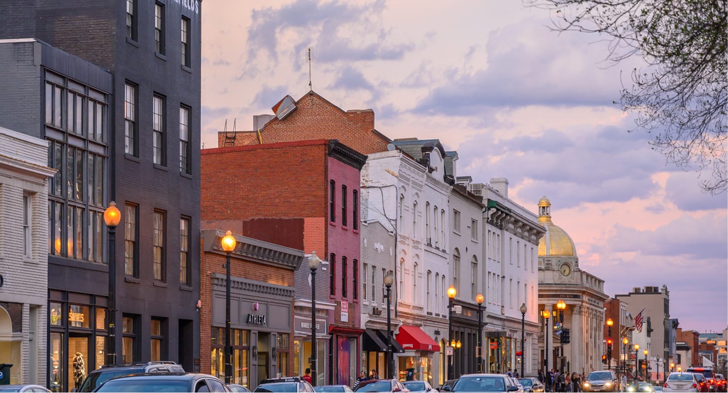 Row of historic buildings at dusk.